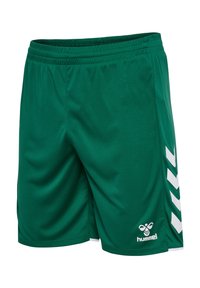 Zielone sportowe spodenki z elastycznym paskiem w talii, białymi paskami w kształcie szewronu po bokach oraz logo hummel w pobliżu dołu prawej nogawki.