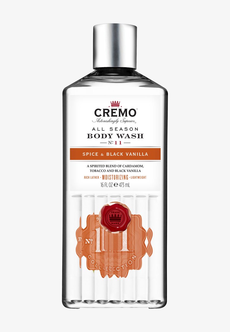 Cremo Gel Douche Toutes Saisons n° 11, parfum épices et vanille noire, flacon transparent de 16 fl oz avec bouchon argenté et étiquette orange.