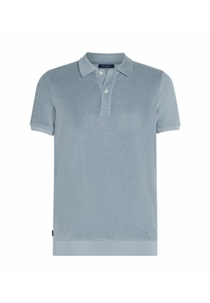 Polo shirt bleu clair en matériau texturé. Doté d'un col classique, de manches courtes et d'une couleur unie avec un subtil éclat.