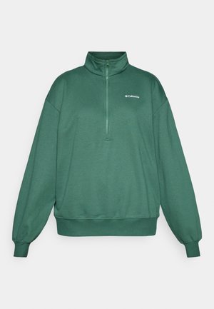 Zelený mikinový pulóver s polovičným zipsom, vyrobený z mäkkého materiálu, so stojacím golierom a elastickými manžetami. Logo Columbia na hornej ľavej strane hrude.