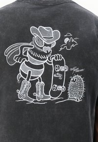 Cartoon bee wearing cowboy boots and hat holds a skateboard labeled Nike SB, facing a smiling cactus saying, "Sweet boots partner!"