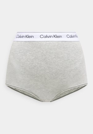 Culottes taille haute en coton gris clair avec ceinture élastique blanche ornée du logo "Calvin Klein" répété en texte noir.