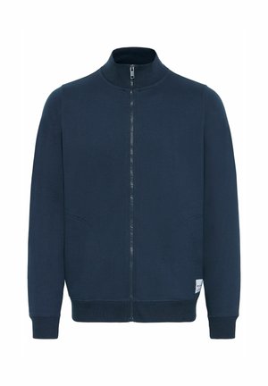 Donkerblauwe ritsvest met hoge kraag, twee zijzakken en ribbelboorden. Gladde textuur en minimalistisch ontwerp.