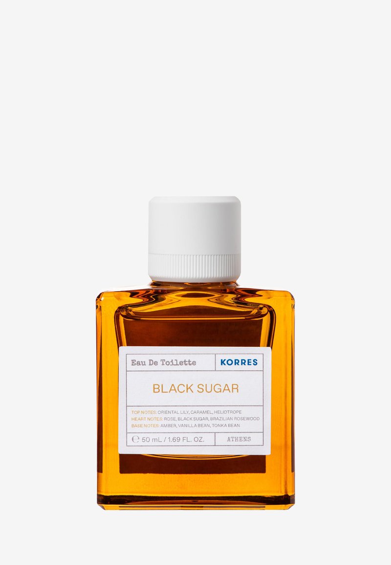 Botella cuadrada de vidrio ámbar con tapa blanca etiquetada como "Korres Black Sugar Eau De Toilette", fragancia de 50 ml con notas florales y dulces.
