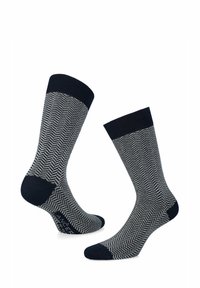 Skarpetki w navy i szary wzórs w jodełkę z ściągaczem, wykonane z miękkiego, elastycznego materiału. Podwójna warstwa w okolicy pięty dla wygody i trwałości.