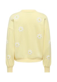 Hanorac galben deschis cu aplicații de margarete albe și galbene împrăștiate pe spate și mâneci, cu manșete și tiv rib.