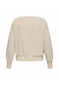 Beige-collegepaita, jossa väljähkö istuvuus, lasketut olkapäät ja resorit hihansuissa. Yksivärinen pinta ja hieman lyhennetty helma.