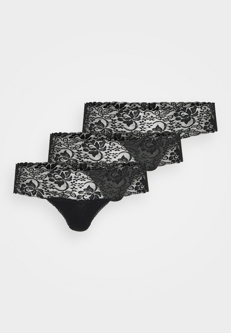 Must mustrükkide komplekt, mis sisaldab kolme tükki, lillemustrid ja sakilised servad. Pehme kangas koos looramiste detailidega.