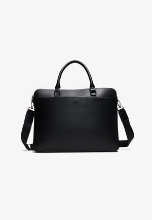 Serviette rectangulaire noire en cuir avec double poignée, bandoulière amovible et logo discret sur le devant, présentée sur fond blanc.