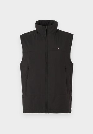 Gilet nero senza maniche con colletto alto, chiusura con zip e due tasche frontali. Presenta un tessuto strutturato e un logo del marchio discreto.