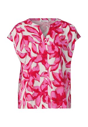 Blouse boutonnée à manches courtes avec un motif floral abstrait rose et rouge sur fond blanc.