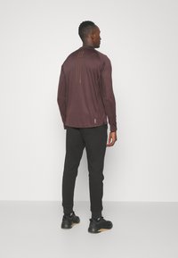 adidas Sportswear ESSENTIALS - Teplákové kalhoty - black