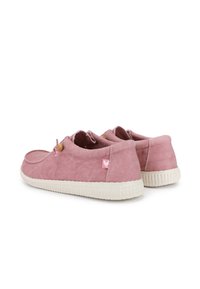 Pink suede shoes with a white rubber sole, featuring a contrasting logo patch and elastic lace detail at the openings.