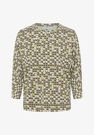 Long-sleeve top featuring a zigzag pattern in earth tones with accents of green and blue, round neckline, and relaxed fit.