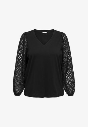 Černý top s výstřihem do V a dlouhými rukávy z jemně vzorované krajky. Tělo je z pevné, hladké látky.