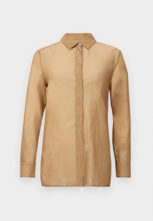 Chemise boutonnée beige à manches longues avec col, présentant une texture lisse et une coupe droite. Design frontal simple et épuré sans motifs.