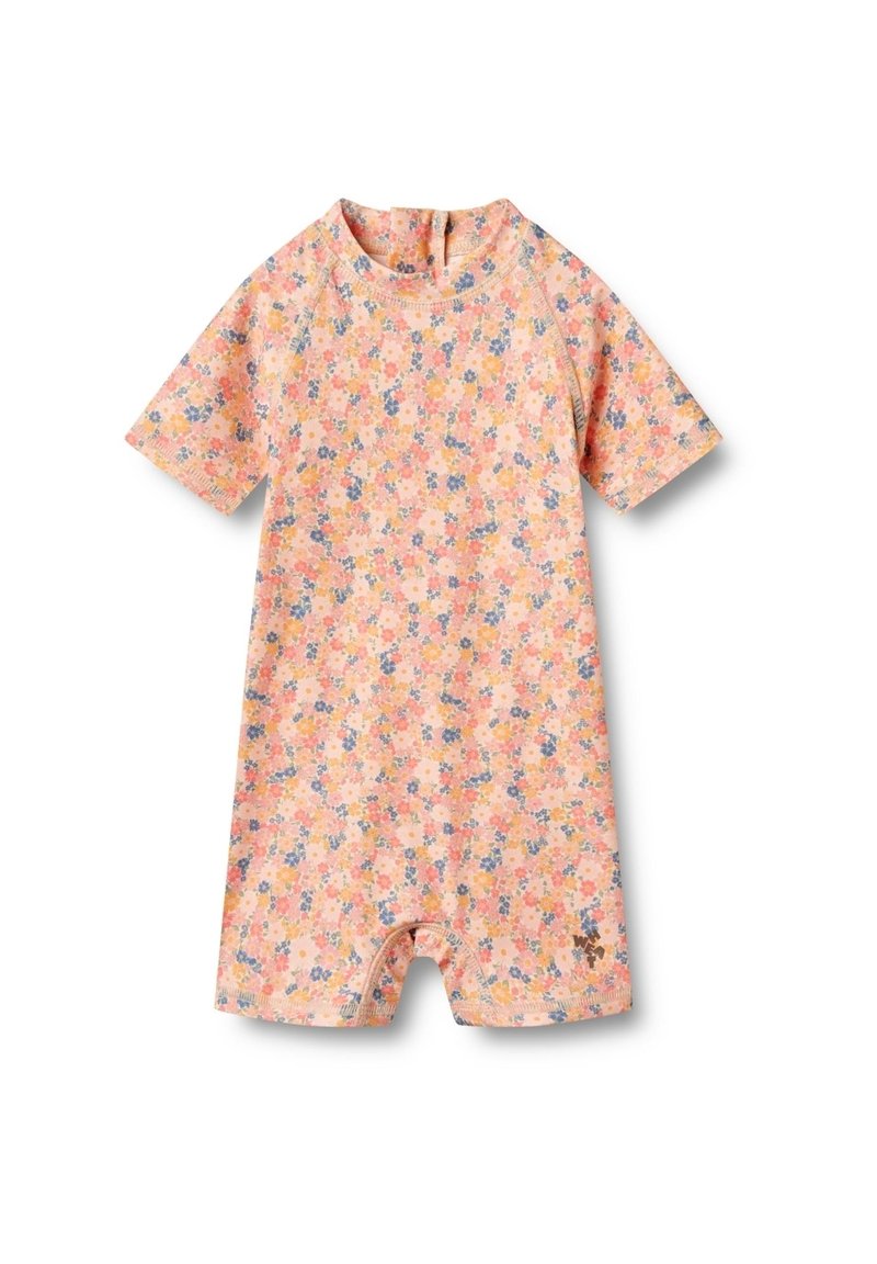 Combinaison à manches courtes en rose pastel avec un motif floral. Fabriquée en tissu doux, elle présente un col rond et une fermeture éclair à l'arrière pour un enfilage facile.