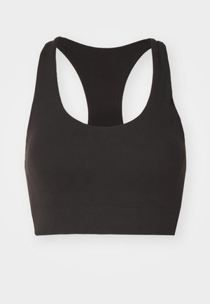 Melna sporta krūšturu ar sporta izgriezumu, gludu tekstūru un minimāliem šuvēm, kas nodrošina ērtību un elastību aktivitāšu laikā.