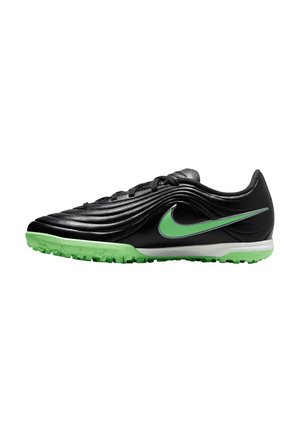 Chaussure de sport noire avec semelle verte et logo Nike Swoosh vert, conçue pour l'adhérence et la performance athlétique.