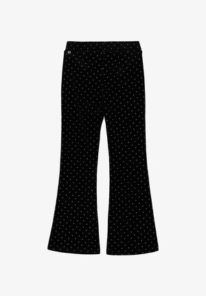 Black flared trousers in a soft velvet material, featuring a white dot pattern throughout. Includes a waistband with a button closure.