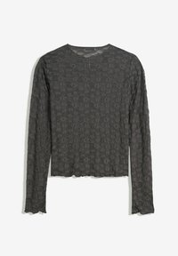 Haut en dentelle à manches longues gris foncé avec un motif floral, encolure ronde et bords légèrement festonnés sur les manches et l'ourlet.