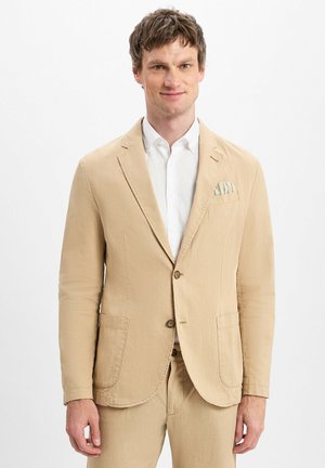 Beige taillierter Blazer aus leichtem Material mit zwei Knöpfen, Reverskragen und vorderen Taschen. Inklusive eines gemusterten Taschentuchs.
