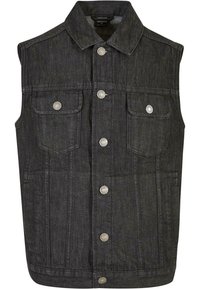 Mörk denim ärmlös väst med krage, två bröstfickor och silverfärgade tryckknappar. Har en strukturerad form och texturerad tyg.