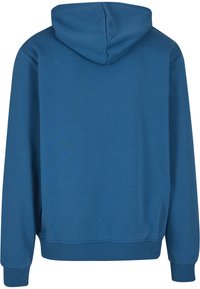 Sweat à capuche bleu uni vu de dos avec manches longues et poignets et ourlet côtelés.