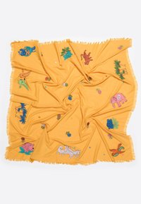 Yellow fabric blanket featuring colorful embroidered patterns of animals and plants, with fringe edges and a soft texture.