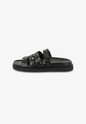 Black leather sandals with three wide straps, silver studs, and a flat rubber sole. The design is minimalistic and open-toed.