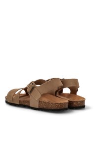 Sandalias de ante marrón con correa ajustable y hebilla, plantilla de corcho, suela plana y diseño de punta abierta. Vista trasera que muestra la forma y los detalles de la sandalia.