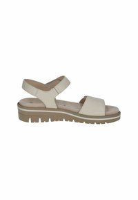 Heled beige sandaalid, millel on tekstuuriga nahast ülemine osa, laia esirihmaga ja reguleeritava tagarihmaga, mustal räni kummist tallal.