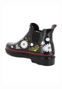 Schwarze wasserdichte Knöchelstiefel mit Blumenmuster, elastischen Seiteneinsätzen und einem roten Streifen entlang der Sohle. Gummimaterial, strukturierte Oberfläche.