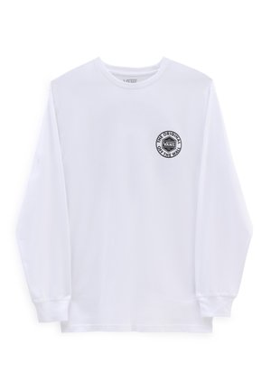 T-shirt blanc à manches longues en coton, avec un col rond et un logo circulaire noir Vans sur le côté gauche de la poitrine. Texture lisse.