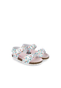 Sandali bianchi con motivi floreali in rosa e verde, dotati di cinturini regolabili e una suola simile al sughero con superficie bianca testurizzata.
