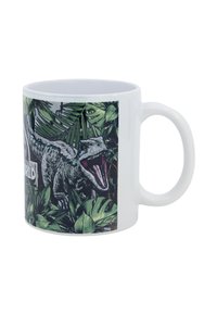 Weißer Keramikbecher mit einem lebhaften Design eines brüllenden Dinosauriers zwischen grünen tropischen Blättern. Der Text lautet "Jurassic World."