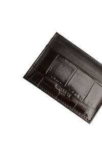 Black leather cardholder with a glossy finish, featuring multiple card slots, embossed branding, and a stitched border detailing.