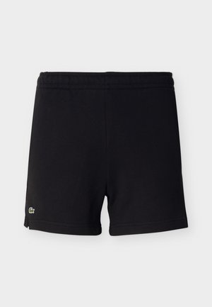 Shorts en coton noirs avec ceinture élastique et petit logo crocodile vert sur l'ourlet inférieur gauche.