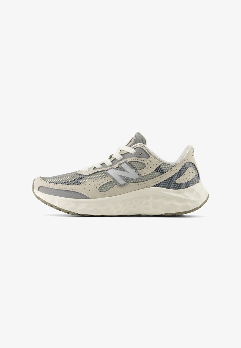 Gray and beige athletic shoe with mesh and synthetic upper; features white laces and a molded sole with textured pattern details.