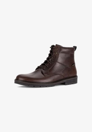 Brown leather ankle boots with round toe, lace-up closure, and textured side panel; flat rubber sole with slight heel; subtle stitching detail.