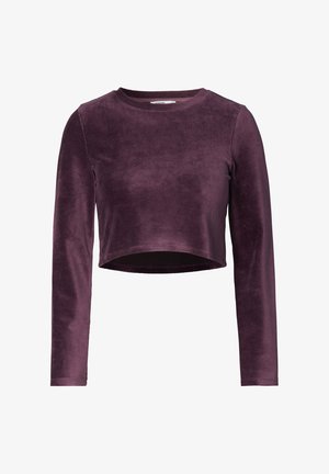 Top court à manches longues en velours violet foncé avec un col rond et une texture lisse. Présente des manches ajustées et un design épuré.