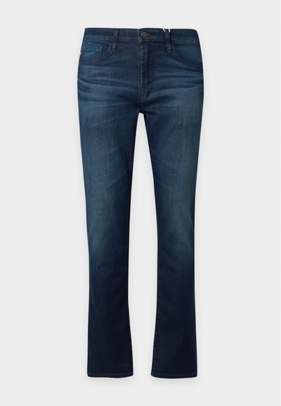 Jean en denim bleu foncé avec une coupe droite, fermeture à bouton et zip à l'avant, et poches visibles à l'avant et à l'arrière.