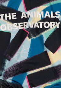 Colorful fabric features abstract patterns in blue, black, and pink, with the text "THE ANIMALS OBSERVATORY" prominently displayed in white.