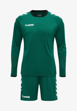 Grøn sportsuniform med langærmet top med sorte accenter og mesh-detaljer, sammen med matchende shorts og hvidt logo.