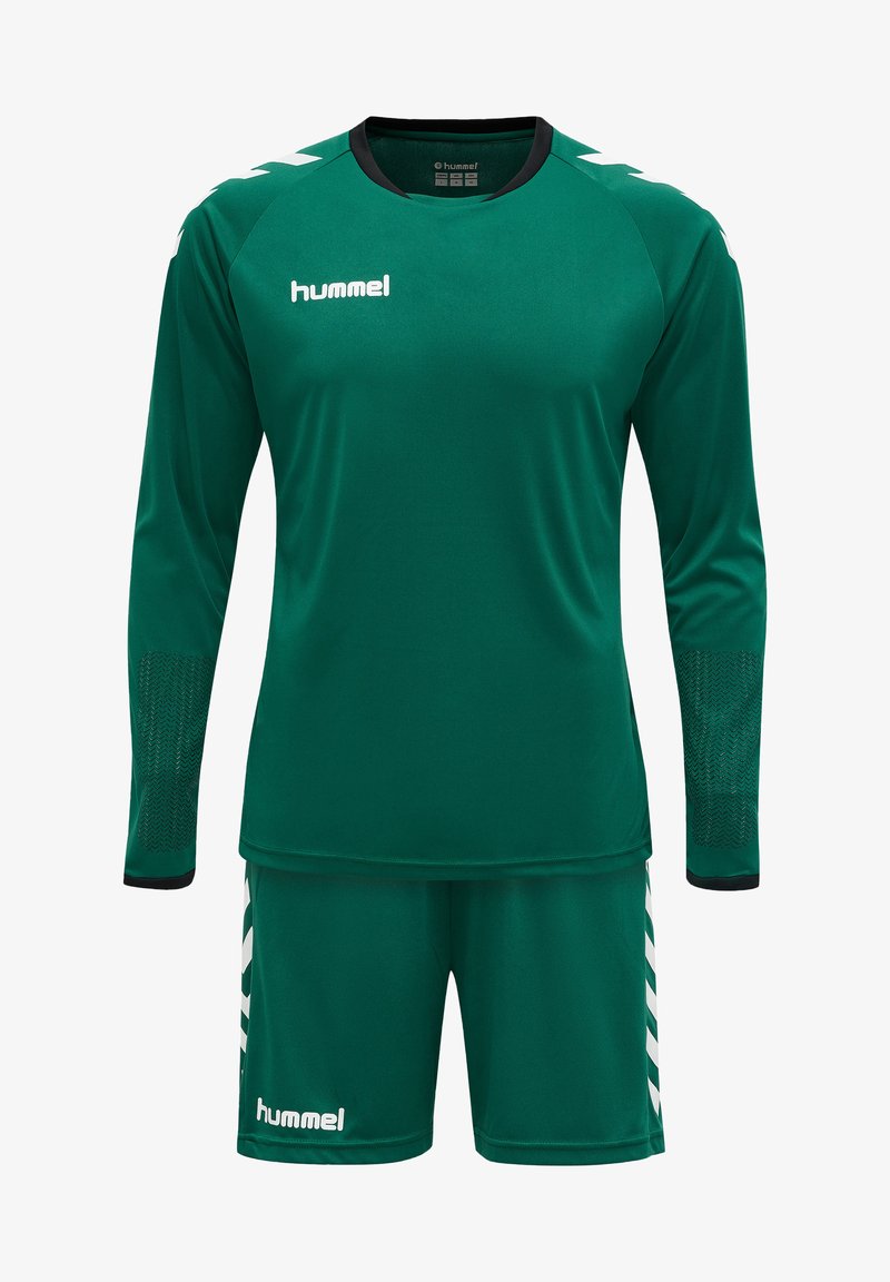 Grüne Sportuniform mit einem Langarmoberteil mit schwarzen Akzenten und Netzdetaillierung, kombiniert mit passenden Shorts und einem weißen Logo.
