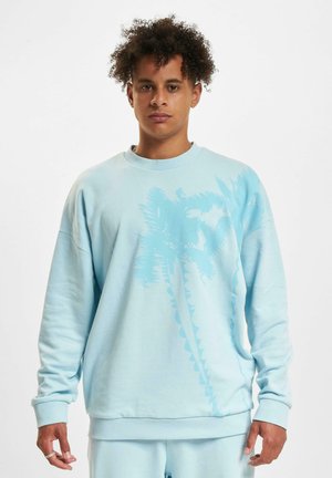 Light blue sweatshirt with a palm tree graphic in a slightly darker shade. Features a round neck and ribbed cuffs and hem for a relaxed fit.