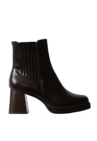 Bottine noire en cuir avec talon bloc empilé et panneau latéral élastique pour un port facile.