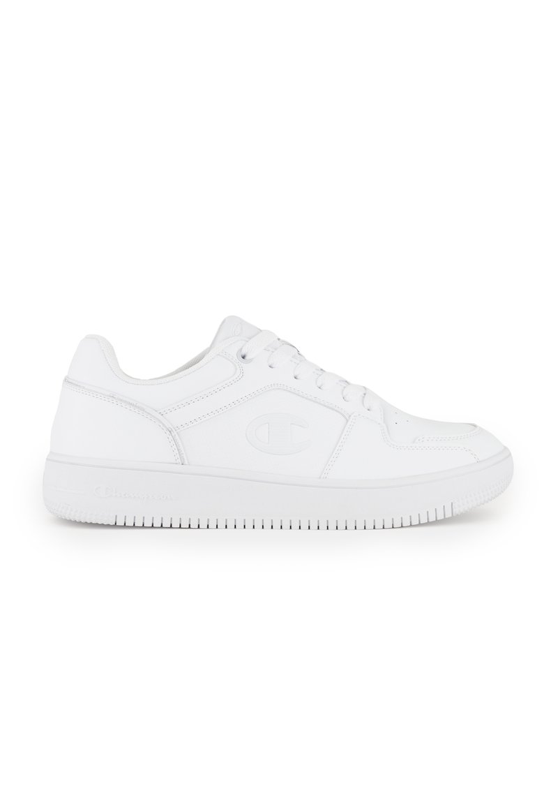 White athletic shoes with a smooth leather upper, round toe, lace-up closure, and textured rubber outsole featuring logo accents.