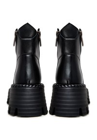 Black leather ankle boots with a high textured platform sole, back zippers, and a detailed rope accent at the sole's edge.