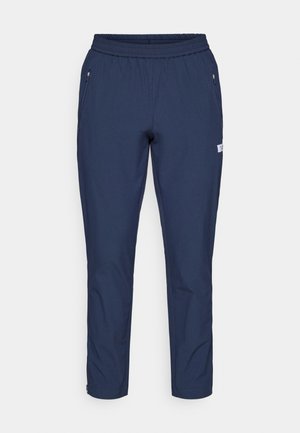 Pantaloni atletici de culoare bleu marin, cu un brâu elastic, două buzunare laterale cu fermoar, design cu picior drept și material ușor.